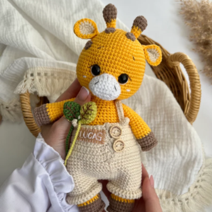 Cute amigurumi giraffe toy, crochet safari stuffed animals, baby shower gift, baby sleeping toy, crochet giraffe, safari nursery decor This cute amigurumi giraffe toy is a charming addition to any baby's world, perfect for cuddles and gentle play. Handmade with care, this crochet giraffe belongs to a delightful collection of crochet safari stuffed animals, making it an ideal baby shower gift or a thoughtful keepsake for new parents. Soft and safe, it doubles as a baby sleeping toy, bringing comfort during naptime. Either placed on a shelf or in a crib, it also serves as lovely safari nursery decor, adding warmth and whimsy to your little one’s space. __________________________ ◌ Height: 9.5 - inches (24 - 26 cm) Clothes are removable. ◌ Materials: organic cotton yarn, hypoallergenic holofiber ◌ NOTE: The toy comes with securely attached safety eyes (plastic eyes fastened from the inside with locking washers). If you prefer embroidered eyes or a different eye color, please mention your preference in the personalization box. ◌ Personalization: You can add a name for your toy, just write the name or first letter in the personalization window. We personalize the toy for free. ◌ Packaging: I offer beautiful free gift wrapping with every order. Each item comes in a reusable cotton bag and includes a plantable seed paper gift card! ◌ Shipping time: 7-14 business days. __________________________ Personalization is available for almost all toys in my store, so please contact me and I will answer all your questions. Best regards, Mariia